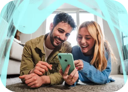 Two young people are watching something on a phone.
