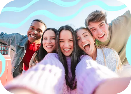 A group of five friends is taking a selfie.
